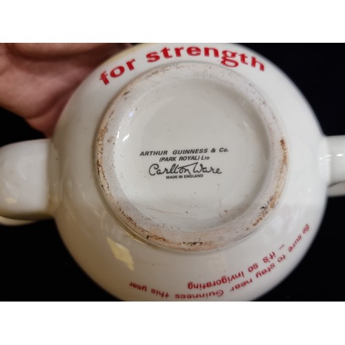 138 - A ceramic teapot with Guinness branding throughout and phrase 