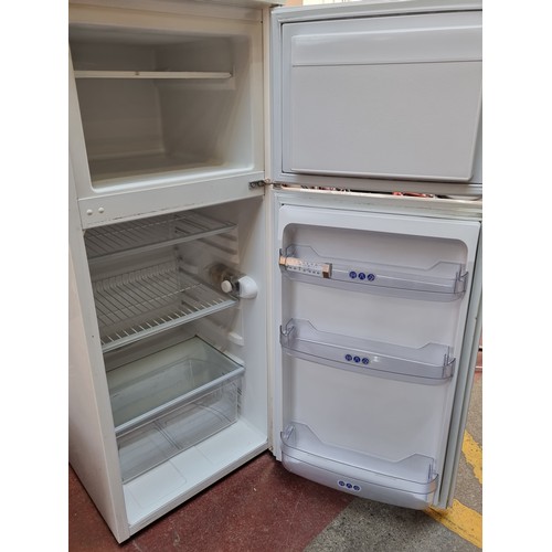 352 - A Whirlpool Class A Fridge Freezer in good order