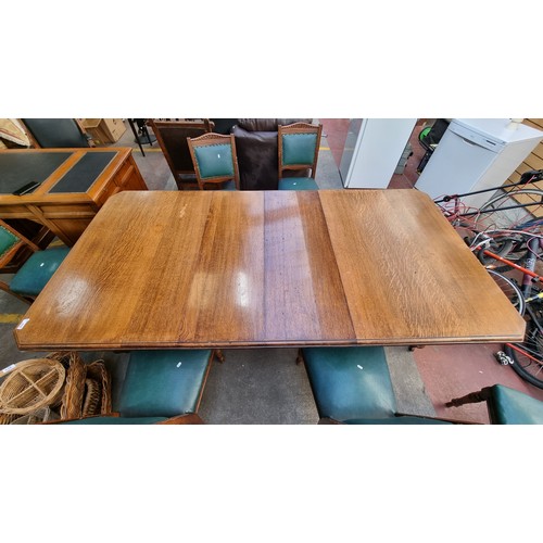 370 - Star Lot : A very large and grand antique oak dining table with 2 extendable leaves accompanied by 6... 