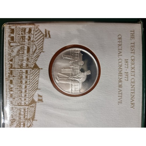 197 - The Test Cricket Centenary 1877-1977 Official Commemorative coin in presentation album, along with a... 