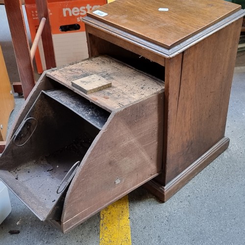 398 - A charming example of an antique wooden coal scuttle with original liner and brass drop handle.