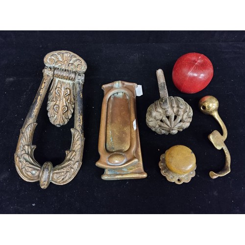 215 - A super collection of five antique door hardware items, including lots of decorative cast metal knoc... 