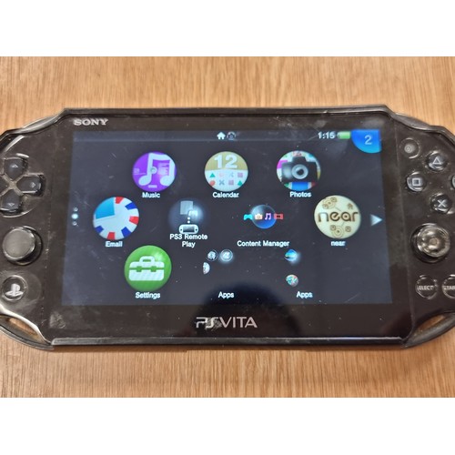 220 - A Playstation Vita handheld games console in original hard carry case.