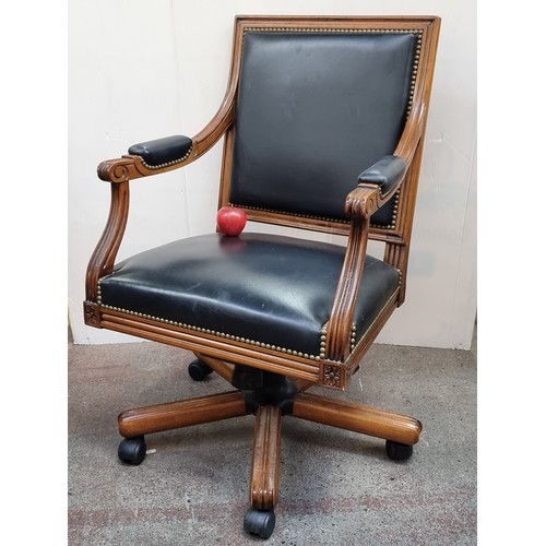 271 - A fantastic example of a captains style chair with swivel seat and large castors. Upholstered in a b... 