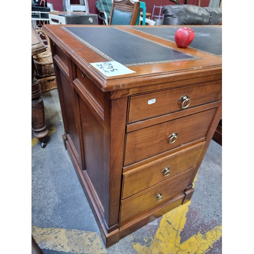 346 - Star Lot - A very handsome Pedestal Desk with a tooled black leather inlay and a number of large dra... 