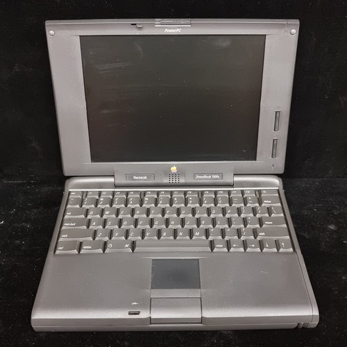 160 - A 1995 Macintosh Powerbook 5300 series personal computer. With power adapter and Apple brand product... 