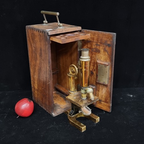 192 - A beautiful example of a 19th century brass microscope, stamped C.Reichert Wenn, housed in a wooden ... 