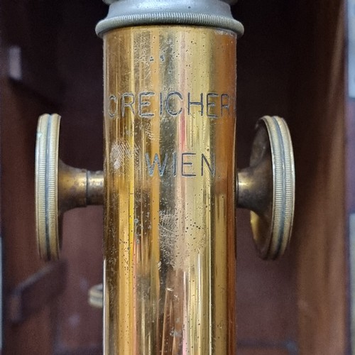 192 - A beautiful example of a 19th century brass microscope, stamped C.Reichert Wenn, housed in a wooden ... 