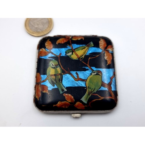 773 - A fabulous vintage Gwenda compact, With enamel birds in the front and two outside original straw wor... 