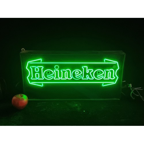 309 - A light-up Heineken bar sign. In good working order with green light text.