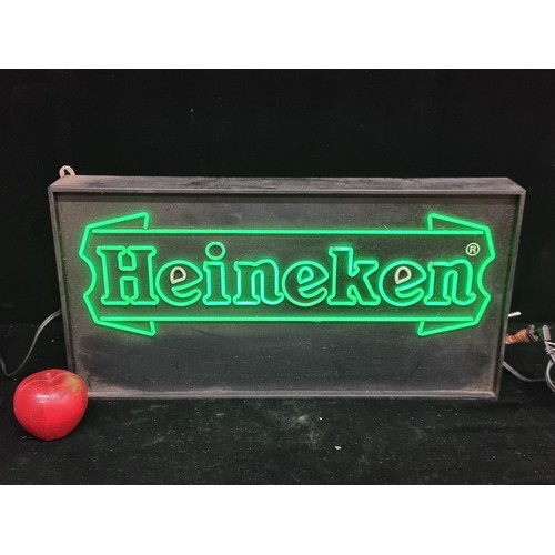 309 - A light-up Heineken bar sign. In good working order with green light text.