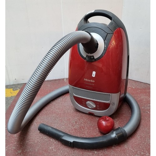 660 - A Miele  C2 Powerline Vacuum Cleaner in the shade Autumn Red. Model SFAF3 - made in Canada. addition... 