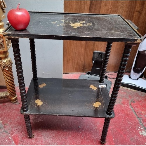 661 - A Victorian Japanese black lacquered two tier drinks trolley with ebonised shelves and black lacquer... 