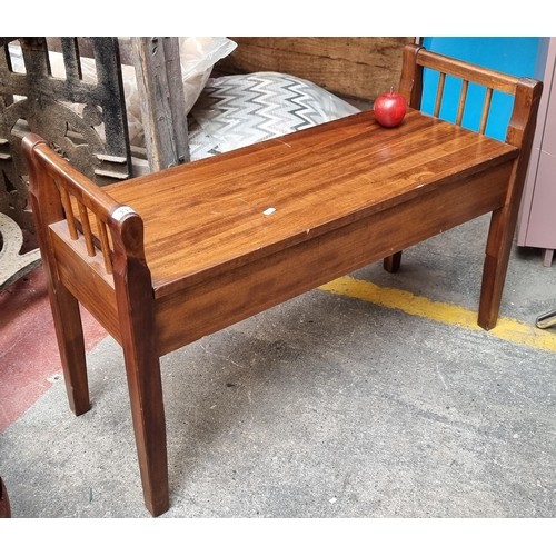 665 - A contemporary wooden storage bench. With railed ends and hinged lid. for storage below H47 cms x L9... 