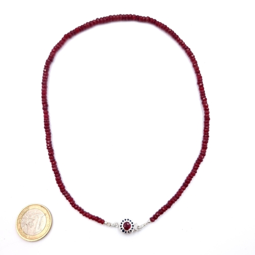11 - A stunning single strand graduated Ruby stone necklace, with a lovely Ruby and Sapphire sterling sil... 
