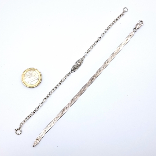 25 - Two sterling silver bracelets, the first is a flat link example. Together with a lovely Celtic desig... 
