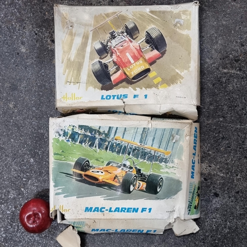 485 - A pair of new in box Heller 1970's Formula One model kits; one for Lotus, and another for Mcclaren.