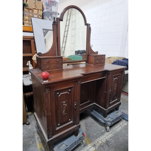 496 - Star Lot : An elegant antique sit in ladies dresser with a dressing mirror and relief carvings of cl... 