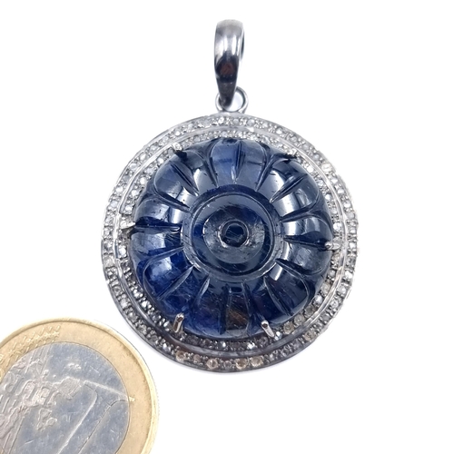 Star Lot : A fabulous sapphire and diamond surround pendant. Length: 4.5 cms, width: 4.5 cms. Weight: 15.05 grams. Sapphire 7.8cts and diamonds 0.70cts . New from the gem stone company. RRP €440.