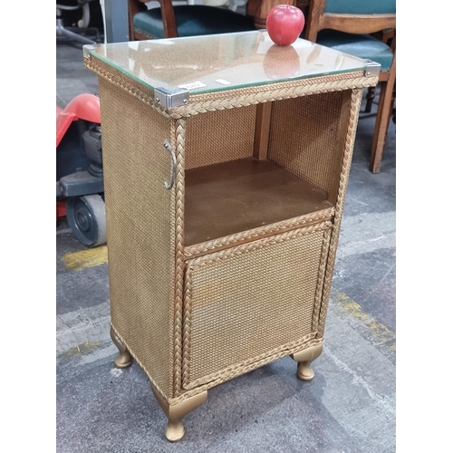 689 - A super charming wicker bedside table after Lloyd Loom with unusual hinged document locker with glas... 