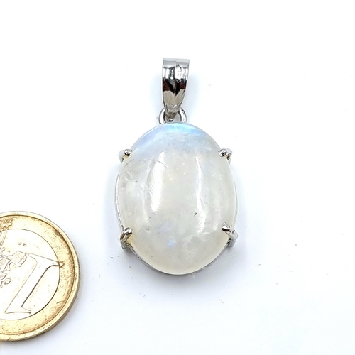9 - A very attractive sterling silver pendant, set with a rare huge Cabochon rainbow Moonstone Approx 60... 