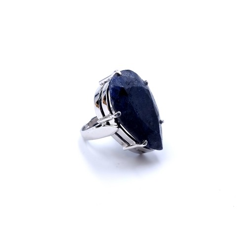 6 - A huge and extraordinary facet cut pear shaped Sapphire ring (approx 49cts), set in sterling silver.... 