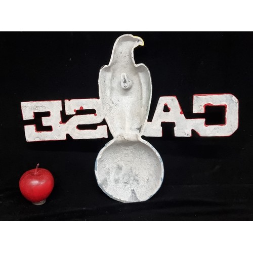 99 - A very heavy cast large metal wall mounting sign reading CASE featuring an eagle atop a sphere readi... 