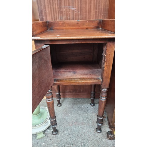 425 - A fabulous looking 19th century pot stand , with gallery back and tall, turned legs set on castors. ... 