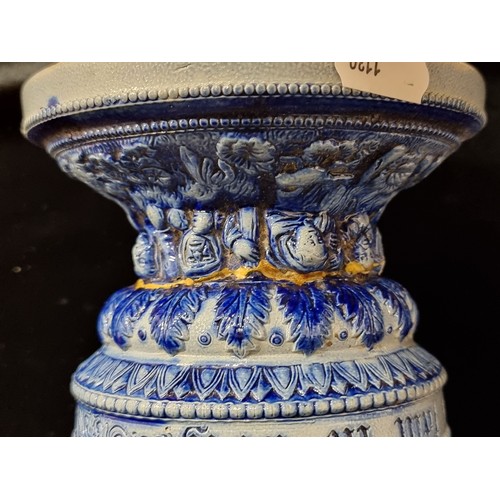 116 - A pair of tall ceramic, stoneware vases. Featuring a cobalt blue glaze and relief detail throughout.... 