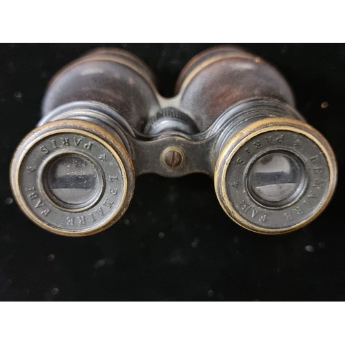 148 - A lovely set of Edwardian WWI military binoculars by Lemaire of Paris. With a leather carry case sta... 