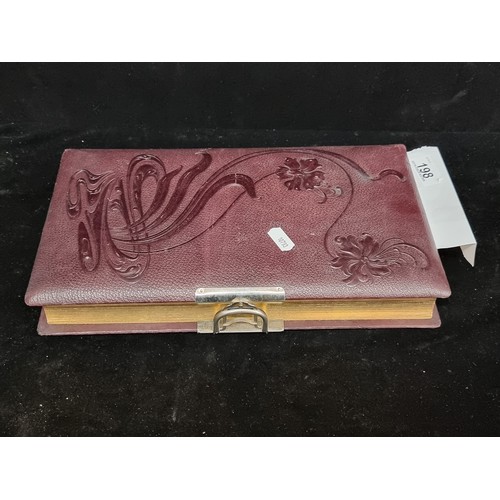 198 - A beautiful antique leather bound photo album with gilt edge, embossed front and chrome clasp. The b... 