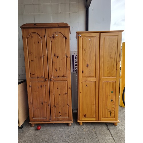 627 - Two good sized pine wood wardrobes, in clean condition.