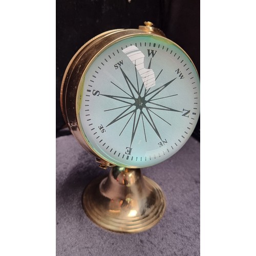 83 - Two items, including an interesting example of a maritime double lensed, magnified clock and compass... 