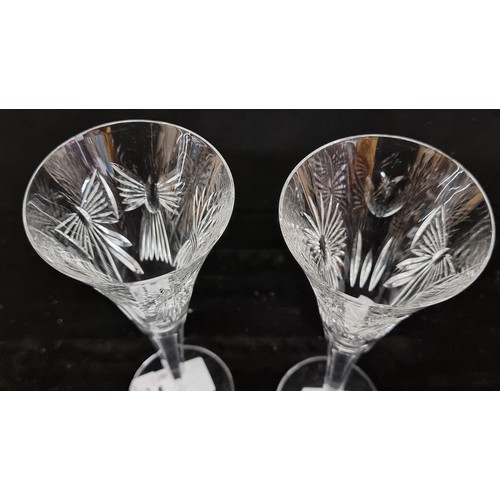 234 - An elegant pair of large Waterford Crystal champagne flute glasses, issued as a millennium celebrato... 