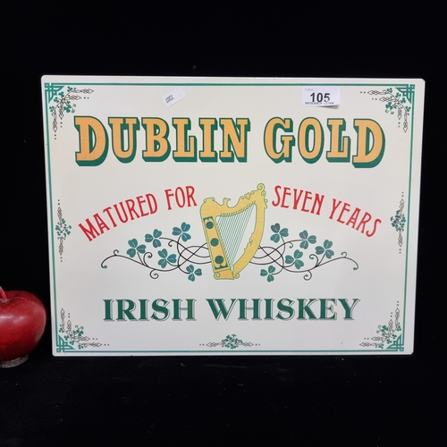 105 - A metal advertising sign for Dublin Gold Seven Year Irish Whiskey, with shamrock motif throughout.