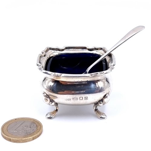 17 - A handsome example of an antique sterling silver cauldron salt cruet, standing on four pawed feet an... 