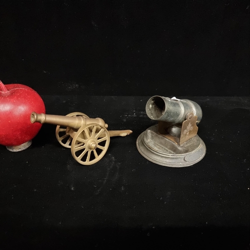 187 - A pair of two miniature metal canons including a silverplated example of the 81 ton gun with lozenge... 