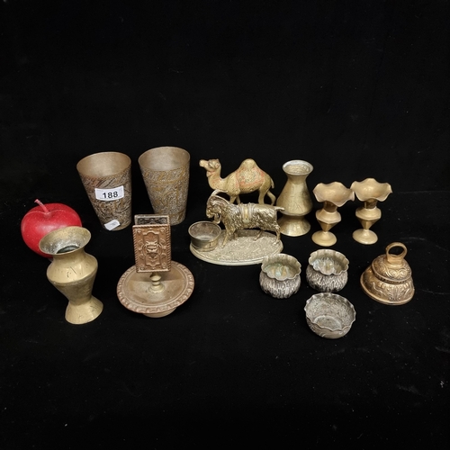 188 - A mixed collection of EPNS and brass items including a brass camel and goat figure, tealight holders... 