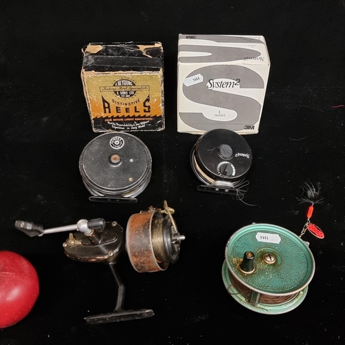 189 - 4 vintage fishing reels including on by Mitchell and two in original boxes.