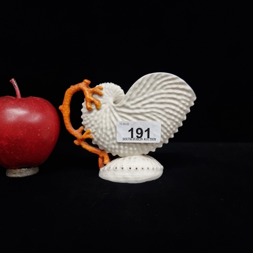 191 - A black mark, early  Belleek conch shell figure with coral detail. VGC Lovely piece.