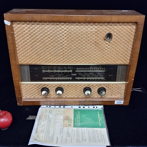 224 - A vintage Murphy A252 brand, Irish radio - this example is complete with its original guarantee and ... 