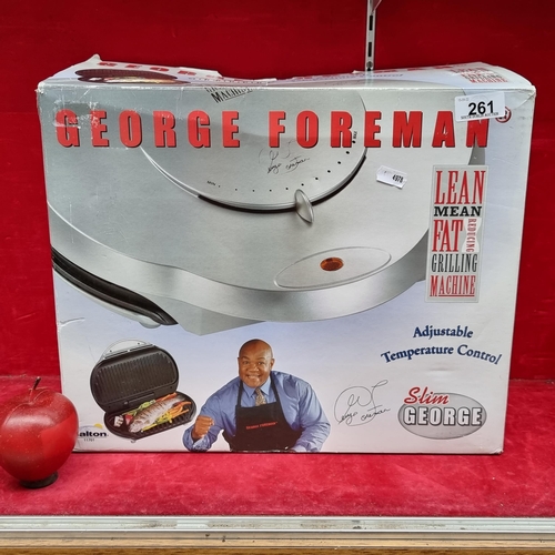 261 - A George Foreman adjustable temperature control grilling machine, in original packaging.