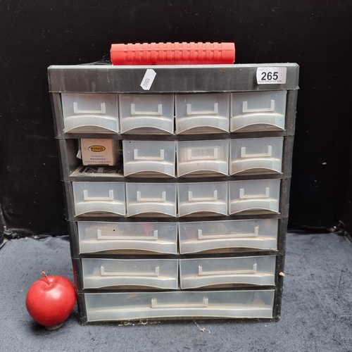 265 - A workbench tool storage cabinet with sixteen compartments, along with a collection of DIY items.