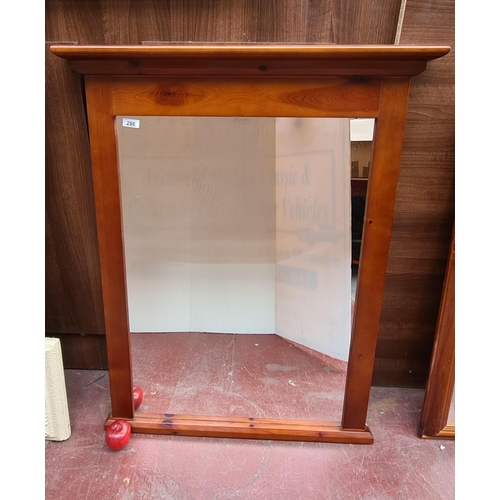 286 - A very handsome, large wall mirror set into a rich wooden frame with central hanging hook to back. H... 