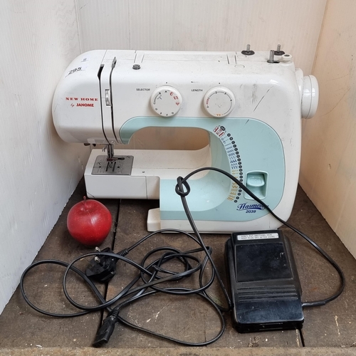 295 - A Harmony sawing machine from the 'New Home by Janome' series, model number 2039. With foot pedal.