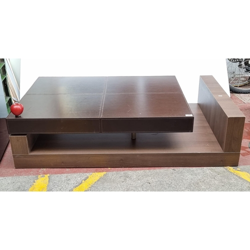 300 - A stylish and contemporary coffee table; this high quality piece features a chocolate brown leather ... 