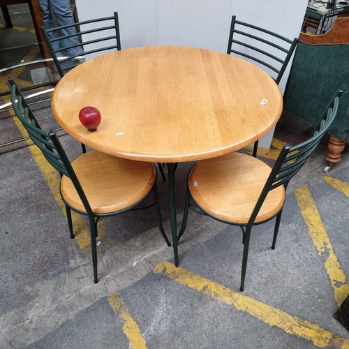 306 - A neatly proportioned circular dining table, with wooden top and forest green metal frame. Along wit... 