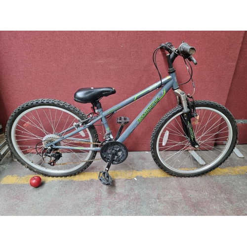 An Apollo Switch Junior Hybrid Bicycle Shimano equipped with 20 wheels