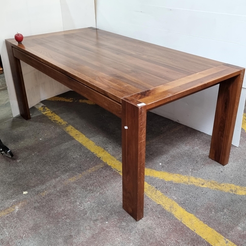 314 - A very handsome heavy wooden dining table with lovely clean lines and substantial block legs. H: 75c... 