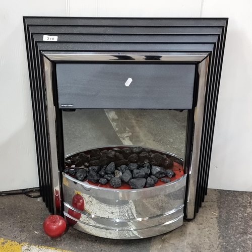 318 - An electric fireplace by Dimplex model VAM20. Operates on 1800-200W with a three-pin plug. H66cm x W... 